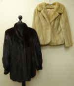 Dark mink three-quarter length fur coat retailed by Dyson Furriers,