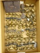 Twenty-five sets of brass door knobs,