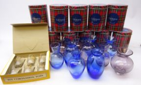 Eleven Caithness amethyst and sapphire glass vases,