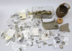 Collection of metal detector finds including jewellery, pins and clips, buckles, belt hooks,