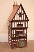 Scratch-built wooden dolls house with some furniture,