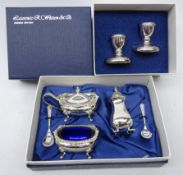 Ex-retail: three piece silver-plated condiment set & pair of silver-plated dwarf candlesticks,