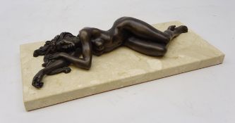 Bronzed study of a nude lady lying,