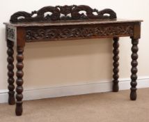 Victorian heavily carved oak side table, raised pierced back, two drawers, turned supports,