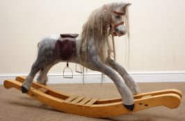 Victorian style wooden rocking horse, painted dapple grey, leather saddle and stirrups, curved base,