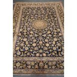Kashan blue ground rug, central medallion, floral repeating border,