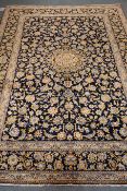 Kashan blue ground rug, central medallion, floral repeating border,