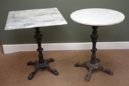Two ornate cast iron column tables, with white and grey veined marble tops, hairy paw feet, W61cm,