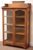Early 20th century oak Arts and Crafts display cabinet, raised back, moulded top,