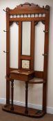 Early 20th century mahogany hall stand, mirrored back with six hooks above hinged lid compartment,