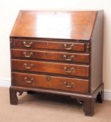 George III oak bureau, fall front enclosing fitted interior above four graduating drawers,