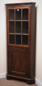 Early 20th century oak floor standing corner cabinet, projecting cornice,
