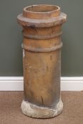 Terracotta cylindrical tapering chimney pot,