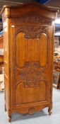 20th century continental walnut armoire, arched pediment, heavily carved floral frieze,
