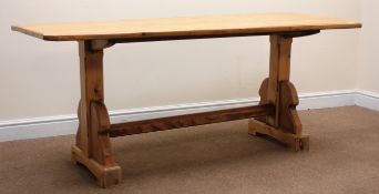 Stripped and waxed pine rectangular table canted corners, solid end supports on arched sledge feet,