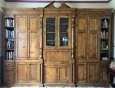 Bespoke figured oak freestanding bookcase/display cupboard, fitted with multiple paneled doors,