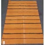 Kilim yellow ground rug with striped field,