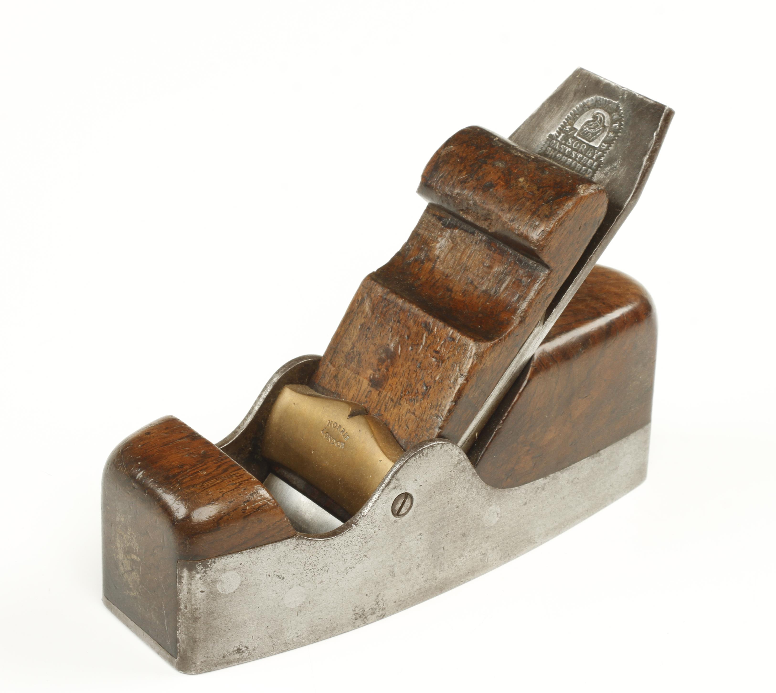 An early d/t steel NORRIS No 4 smoother with scrolled wedge and cupids bow brass bar,