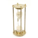 A brass cased hour glass G++