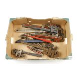 Ten Stilson type wrenches and two chain wrenches G+
