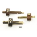 Three rosewood or ebony and brass gauges G+