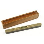 A little used 9 1/2" ebony level by MARPLES with raised brass top in mahogany box dated 1878 inside