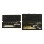 Two sets of drawing instruments by RIEFLER one brass the other steel (lacks pencil lead tube) G+