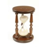 A mahogany cased hour glass G++