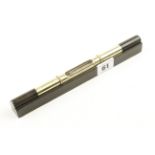 A MATHIESON No 18C 9" ebony and brass level with raised tube and roll over protector G+