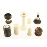 Eight ivory and ebony items ornamentally turned on a Holtzapffel lathe,