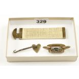 A miniature brass shave with 1 1/2" round sole,