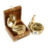 Two reproduction brass compasses G