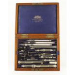 A two tier drawing set by HARLING London with ivory parallel rule beneath in orig brass trimmed
