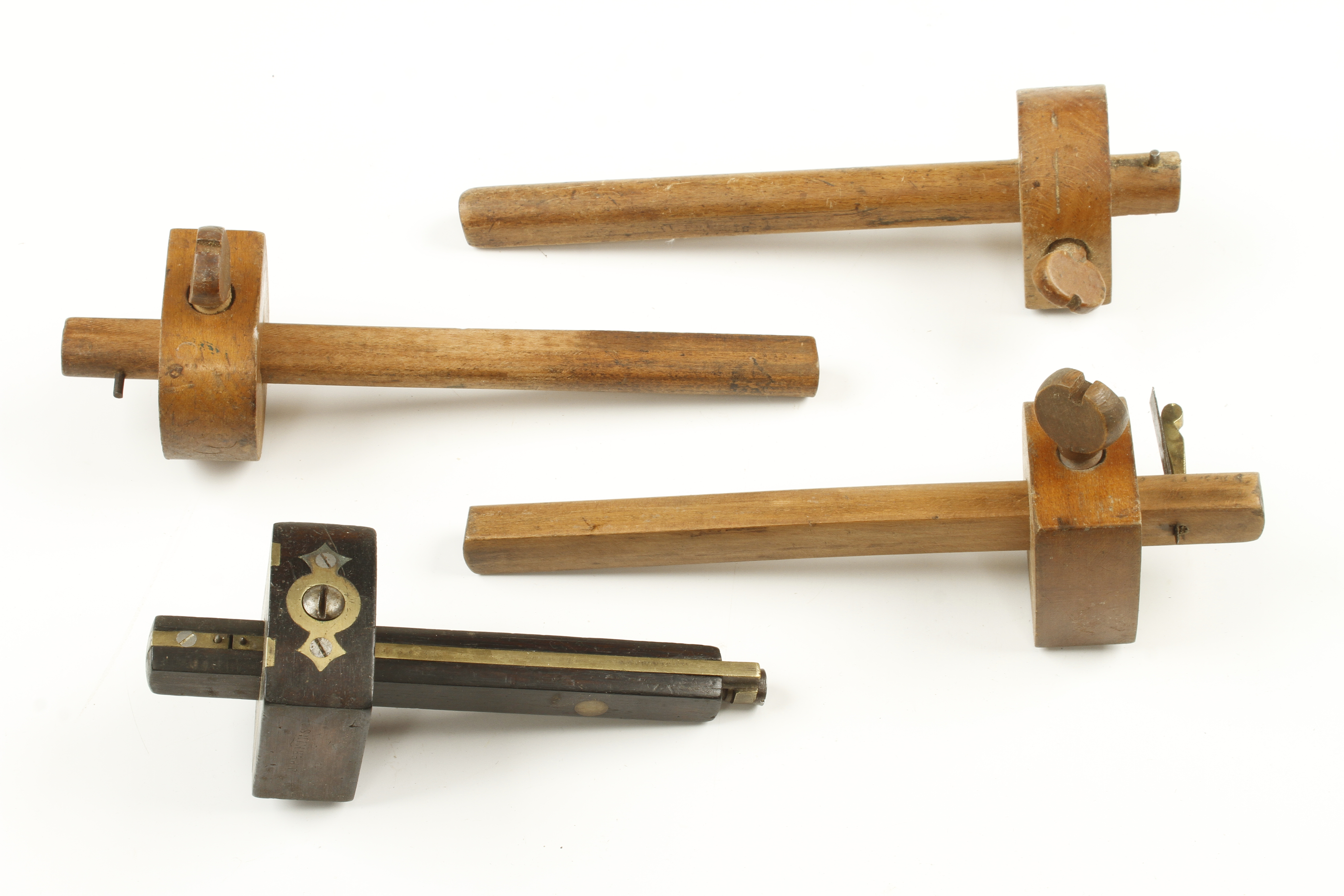 A rosewood brass faced mortice gauge and a beech marking gauge by FROST Norwich a beech slitting