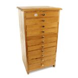 A fine 11 drawer pine chest measuring 18" x 18" x 36"h.