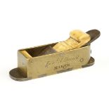 An early miniature brass mitre plane with d/t steel sole nicely engraved Edw'd Davies Maker 4" x 1