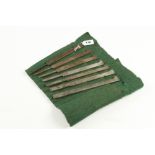A part set of 7 plough irons by GRIFFITHS in baize roll G+