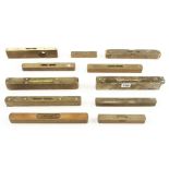 A brass topped sighting level for restoration and ten other levels G-