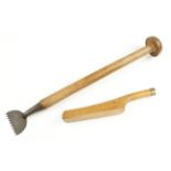 A beech handled carpet stretcher and a plumbers boxwood lead dresser both by GRIFFITHS G+