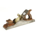 A fine quality 14 1/2" Scottish iron panel plane with mahogany infill and handle,