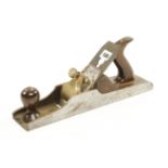 A 13 3/4" craftsman made iron panel plane with added Norris brass lever for restoration