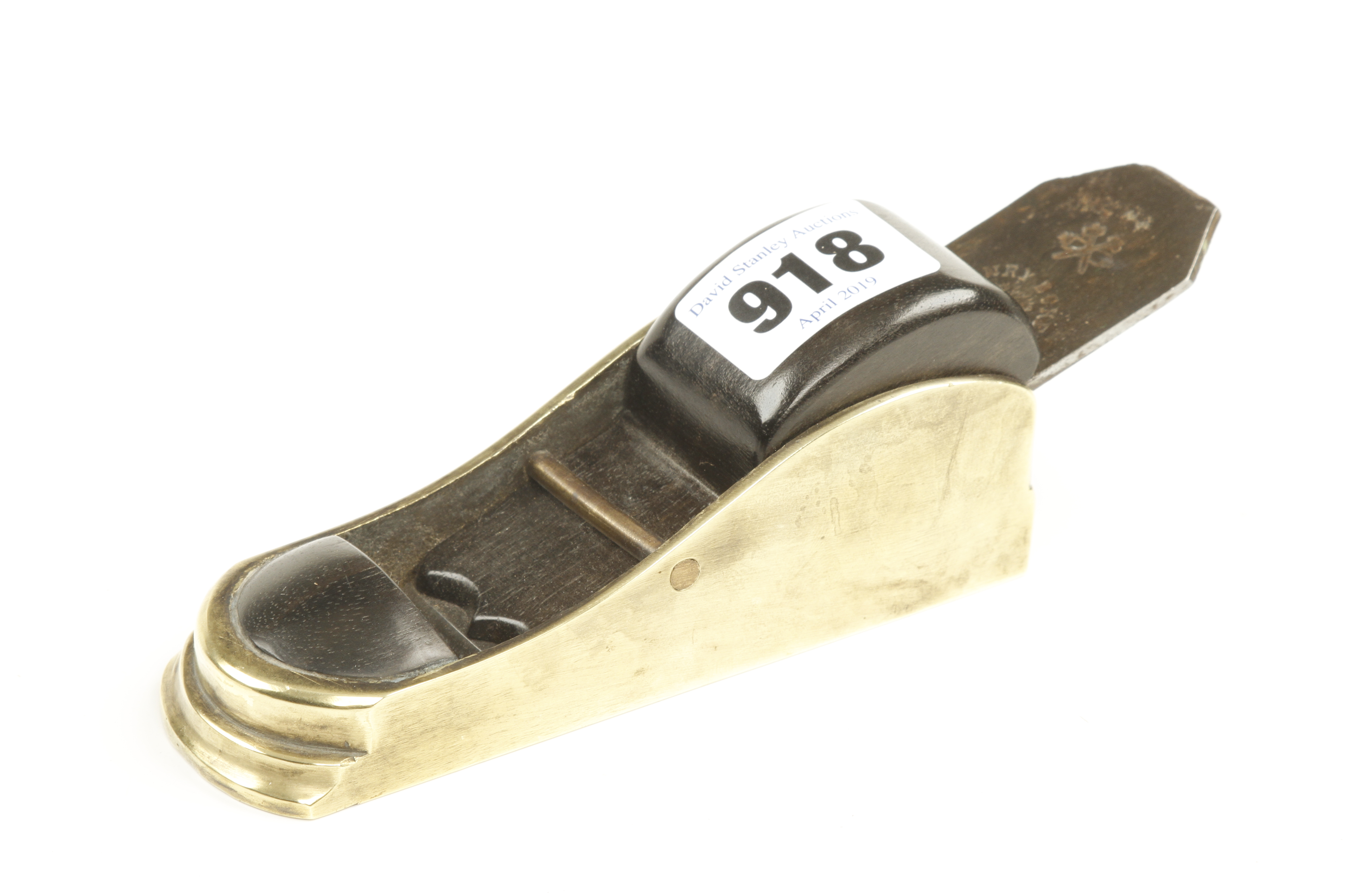A brass thumb plane 4 5/8" x 1 1/2" with stepped toe and ebony infill and wedge G+