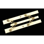 A pretty 6" ivory parallel rule with pierced brass hinges,
