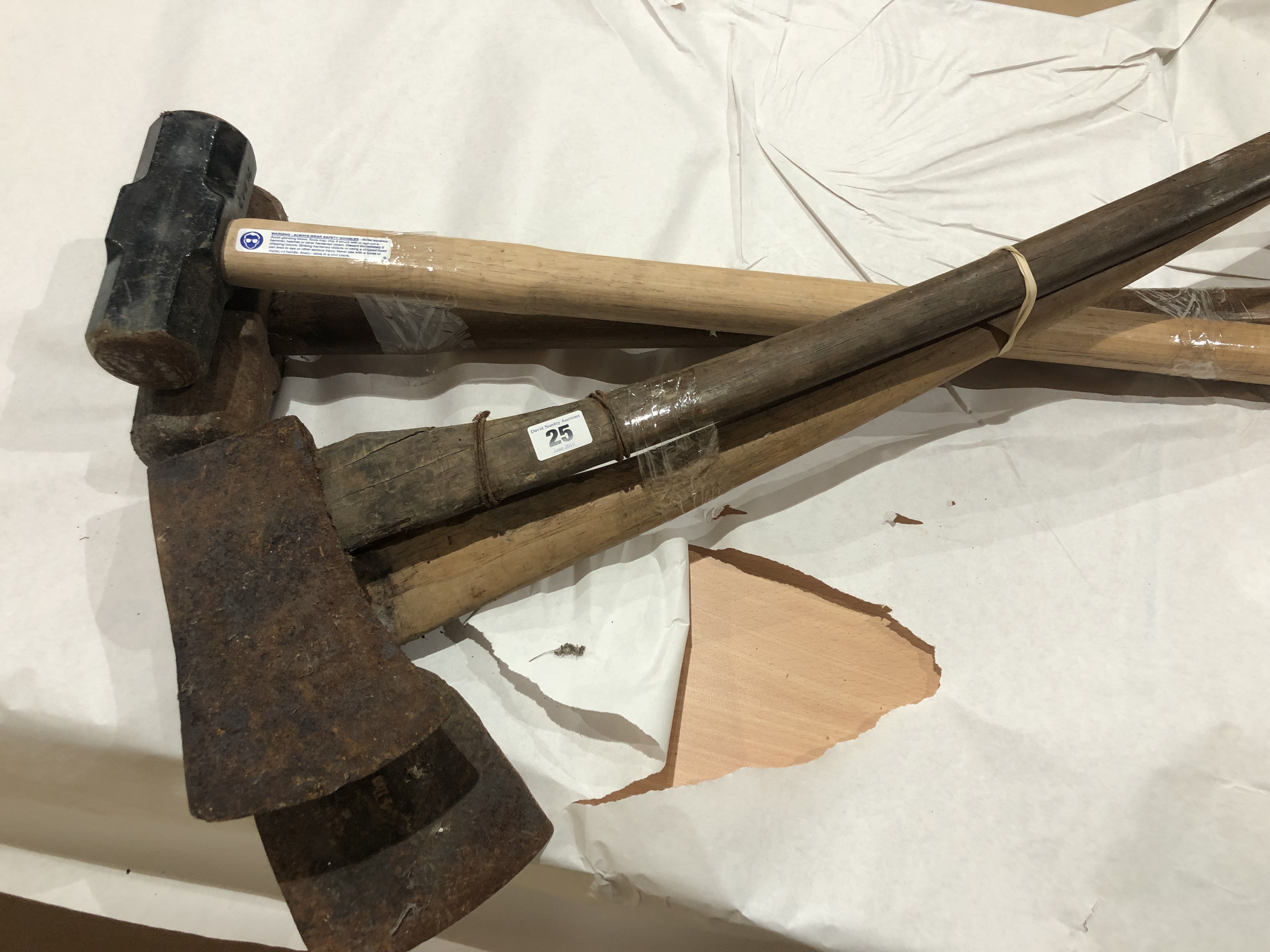 Two sledge hammers and two axes G