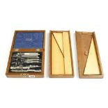 A part set of drawing instruments and two part maquois rules G-
