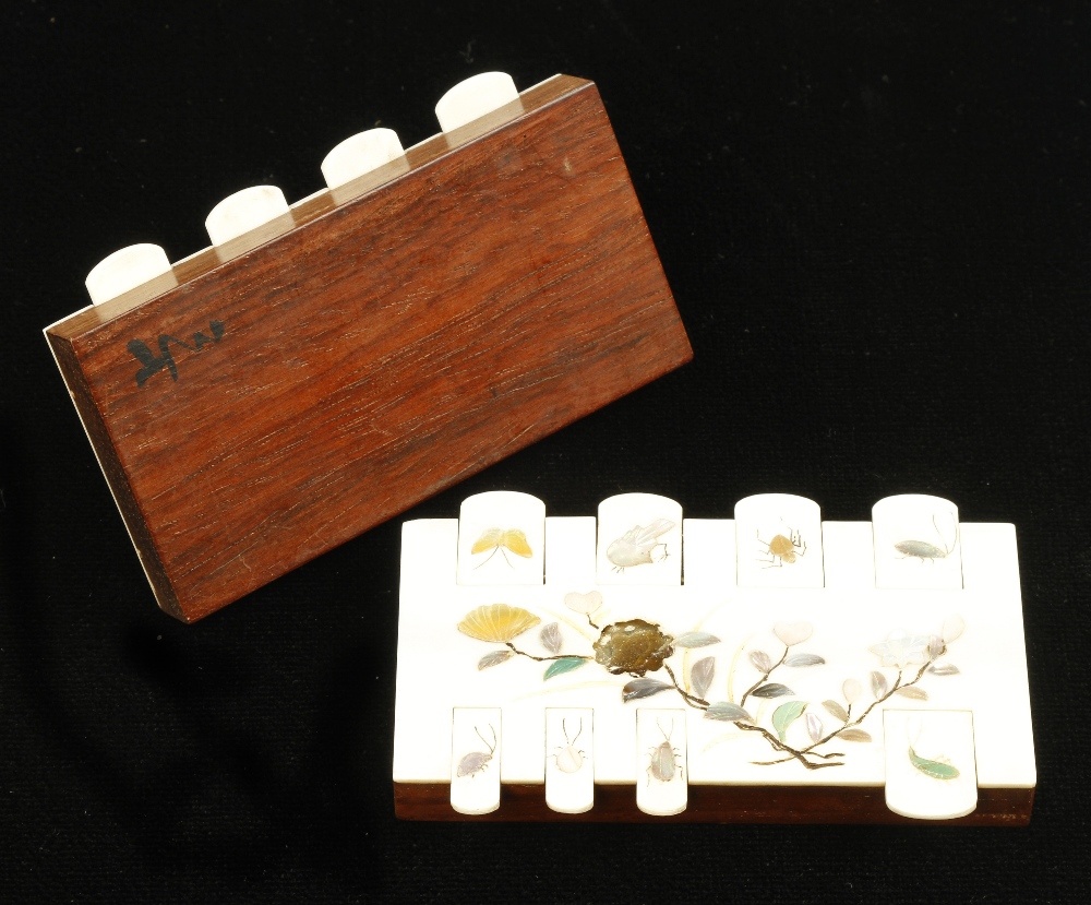 A fine pair of ivory card counters on polished mahogany bases with intricate floral and insect - Image 2 of 3