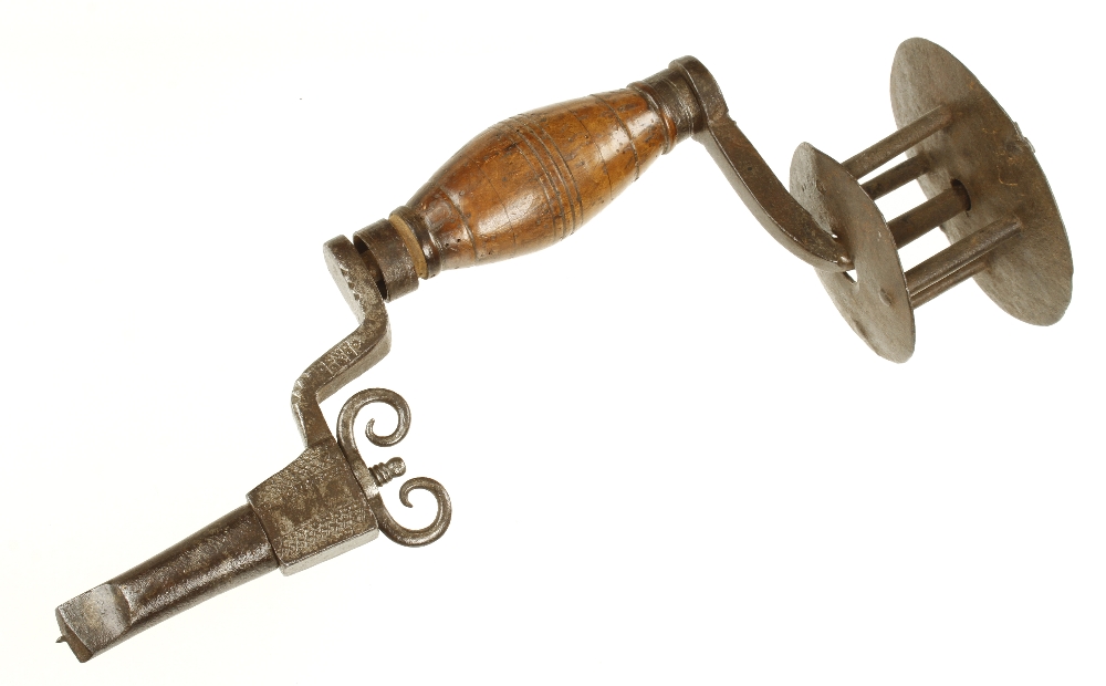 An important 17/18c German four bar cage head iron brace with attractive decoration to the frame,