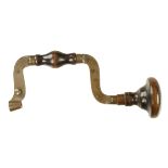 A fine quality 19c French spring pad brass brace with flat section frame and fruitwood head and