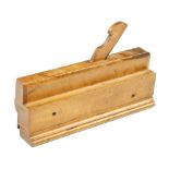 A rare 9 1/2" boxwood grooving plane with moulded boxwood fence,