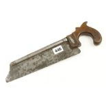 A surgeons steel back saw with fruit wood handle,